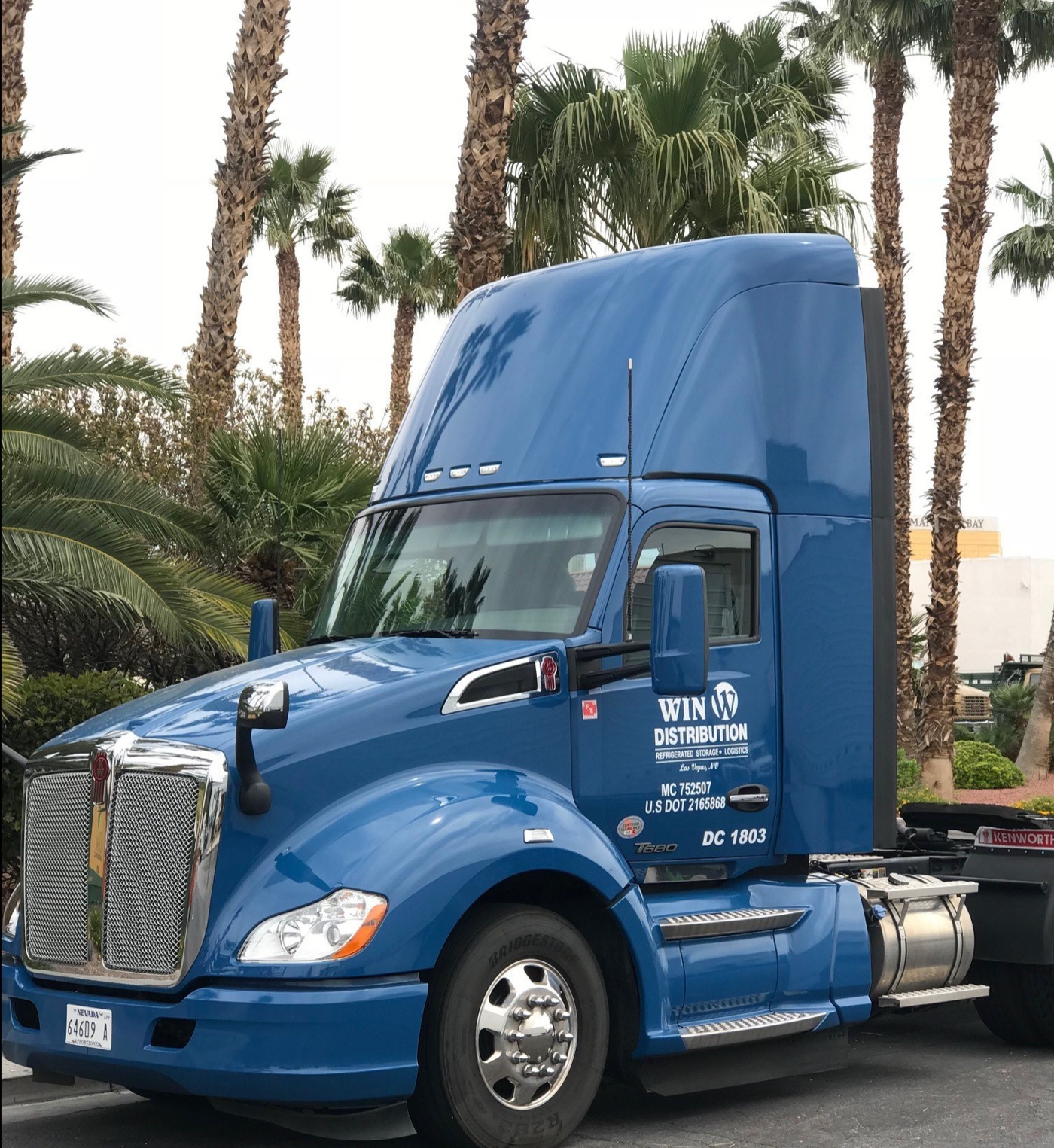 WIN Distribution blue Peterbilt truck